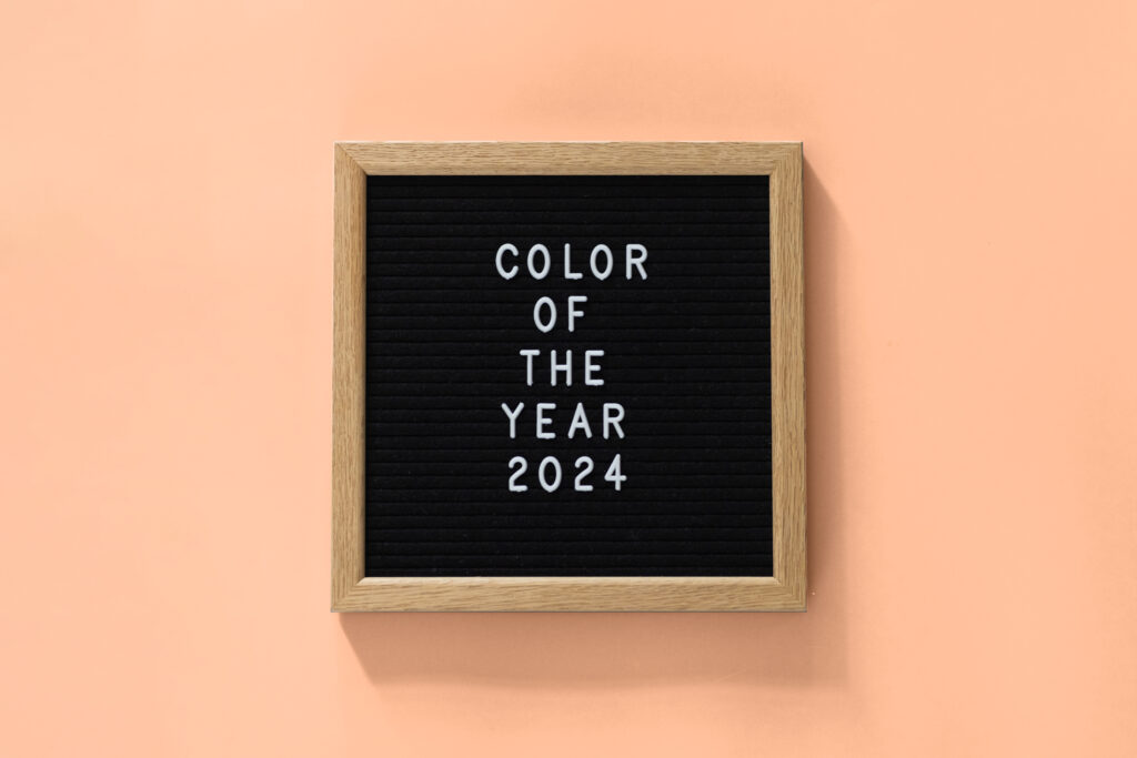 Color of the year 2024 peach fuzz. Trendy colors concept, mockup with copy space.